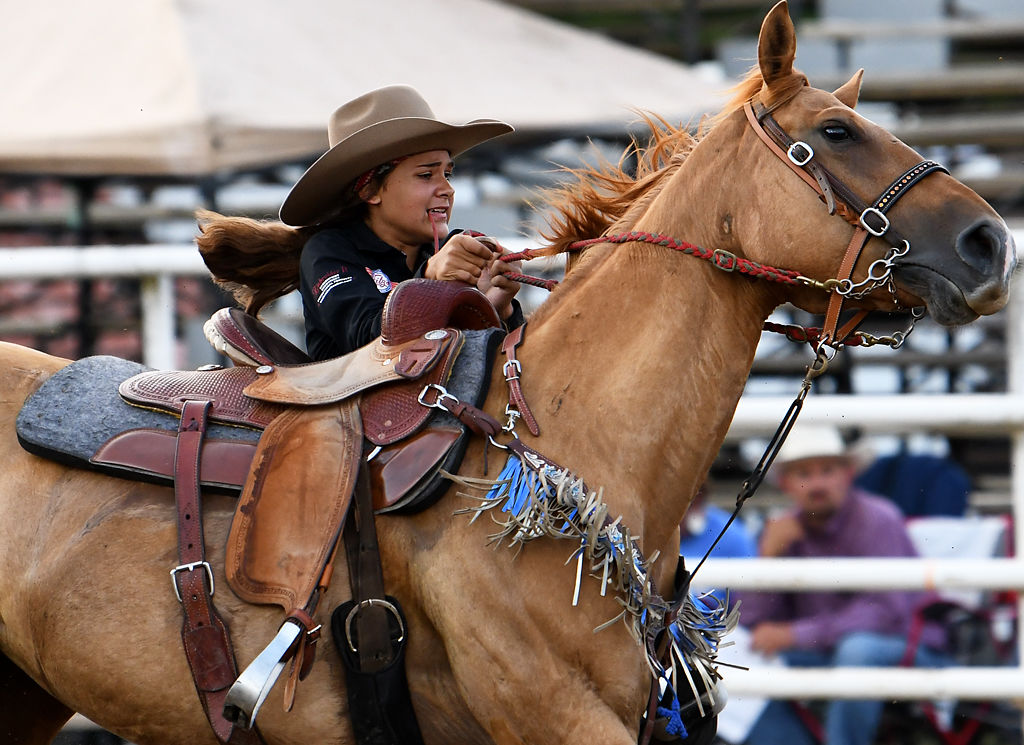 Madison Munoz of Columbia, Missouri, participates in the goat tying event on Saturday